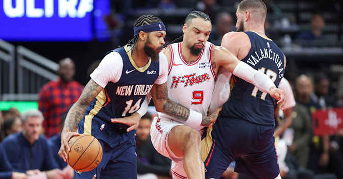 Houston Rockets forward Dillon Brooks defends New Orleans Pelicans forward Brandon Ingram